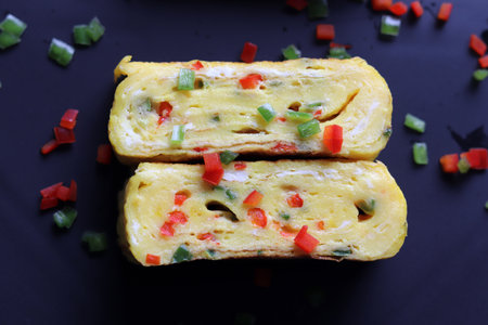 Egg roll made with red paprika and bell peppers.