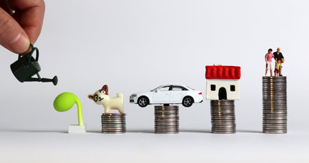 investment in childcare. Business Concept with Miniatures and Coins.