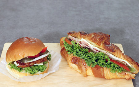 close-up images of hamburger and sandwich. Bread with vegetables and ham.の写真素材