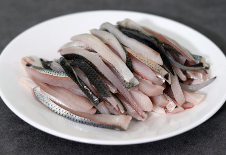 Close-up image of gizzard shad sashimi on plate.の写真素材