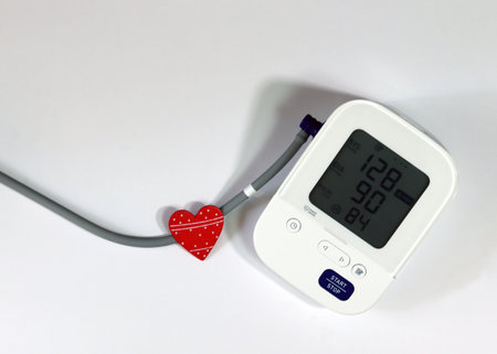 Red Heart and Blood Pressure Monitor Heart Disease Diagnostic Concept. Digital blood pressure...