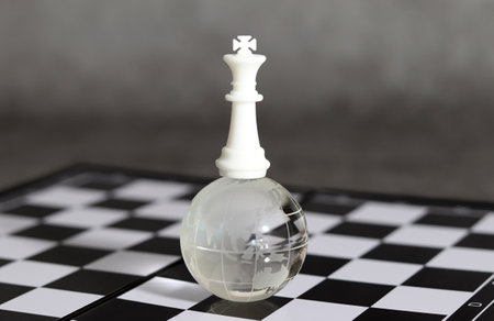 White Chess King on a globe. Victory or success concept.の写真素材