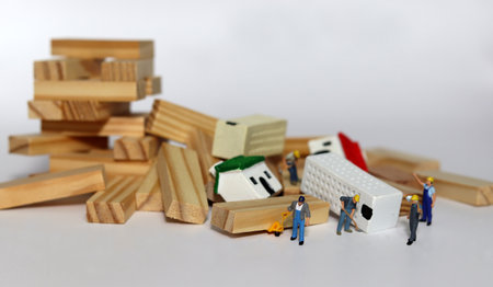 Crisis in the real estate market. Houses lie between collapsed blocks and are being cleared by...
