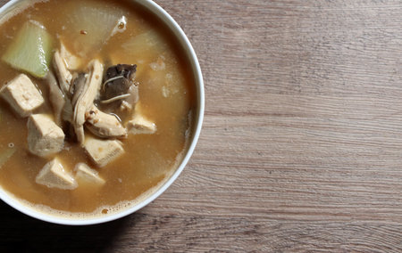 A savory soup made from a sauce made by fermenting beans. Soybean paste soup boiled with chicken breast.の写真素材