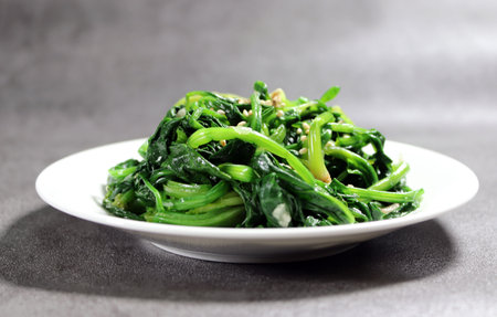 Spinach vegetables seasoned with salt and sesame oil. Korean style vegetable side dish.の写真素材