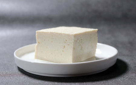 Tofu made by boiling soybeans. A healthy dish made from soybeans.の写真素材