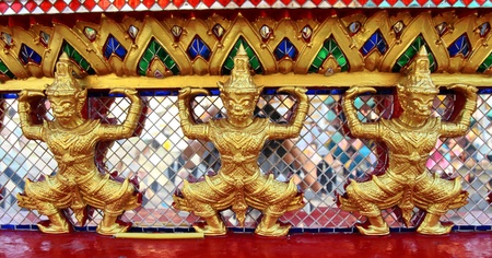 Thai temple painting a giant statue のeditorial素材