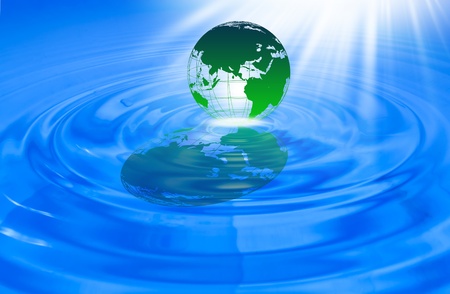 World globe in blue water の写真素材