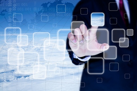 hand of business man pushing a button on a touch screen interfaceの写真素材