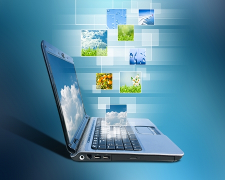 notebook and button a touch screen interface against blue backgroundの写真素材