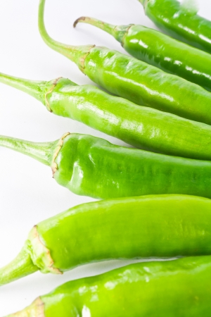 Red and green pepper on a white backgroundの写真素材