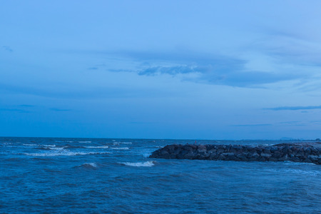 Sea Waves touching sandy beach eveningの写真素材
