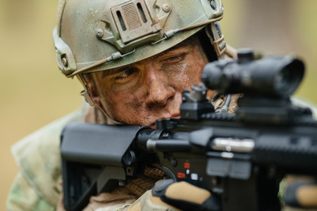 operator aiming through the scopeの写真素材