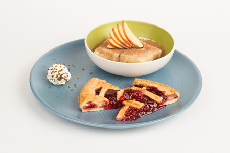 a variety of delicious desserts on a blue plateの写真素材