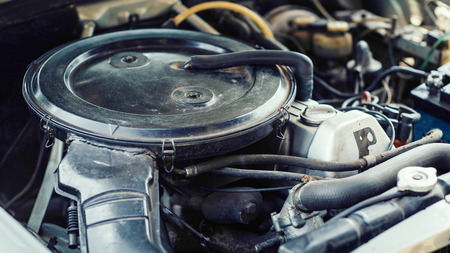 A close up of an air filter on a car engineの写真素材
