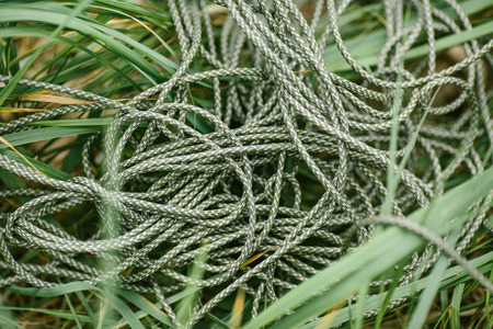 Mess green rope against wood backgroundの写真素材