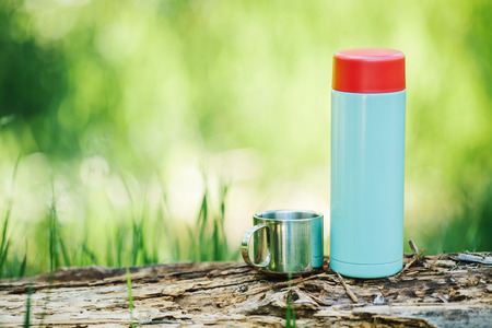 Water bottle on wood  with summer scene backgroundの写真素材