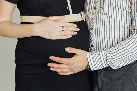 A beautiful young couple waitnig for the arrival of their babyの写真素材