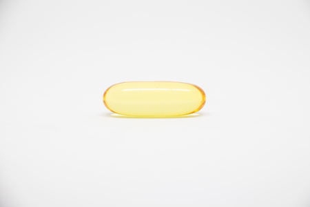 fish oil capsules on a white background close upの写真素材