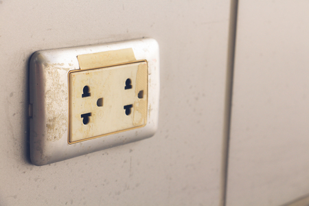 Closeup the electrical plug socket on gray wall.の写真素材