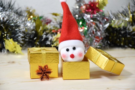 snow man in gift box with christmas decorationの写真素材