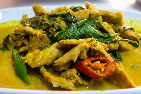 Stir fried pork and curry paste win dishの写真素材