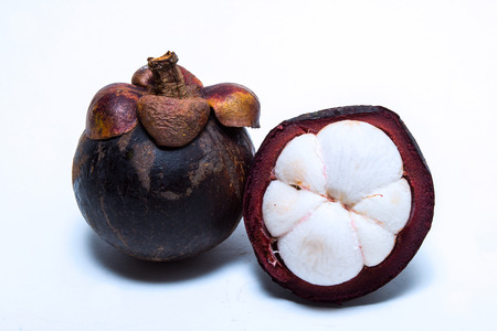 Mangosteen is isolate on white backgroundの写真素材