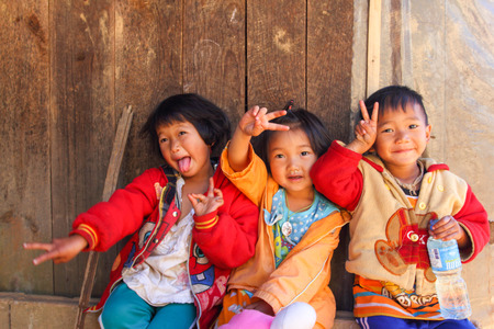 FANG DISTRICT, CHAINGMAI, THAILAND - JAN 23, 2013: Hill Tribe children play at Royal Agricultural Station Angkhang.のeditorial素材