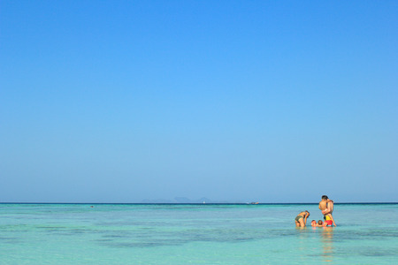 SATUN, THAILAND - MARCH 14, 2014: Parents and children are swimming in the sea, Lipe islandのeditorial素材