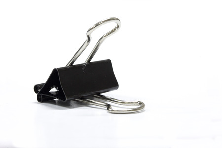 Black Paper clip isolated on white background.の写真素材
