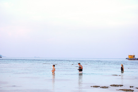 SATUN, THAILAND - SEP 29, 2014: Man and women are swimming in the sea, Lipe islandのeditorial素材