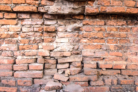 Red brick wall collapses