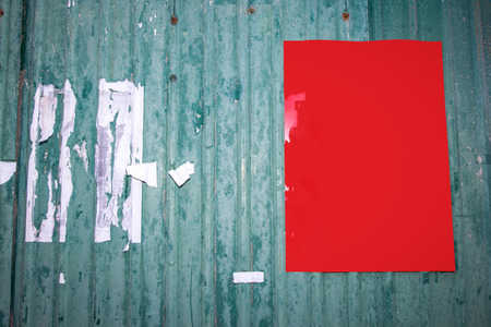 Red empty poster on green zinc backgroundの写真素材