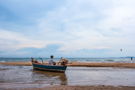 PATTAYA, CHONBURI- MAY3, 2015: Thai traditional fisherman stay at Pattaya beach, Chonburiのeditorial素材