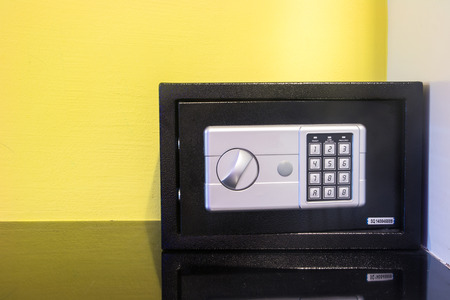 a security steel safe on yellow background