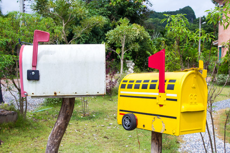 Mail boxes in front of suburb house.の写真素材