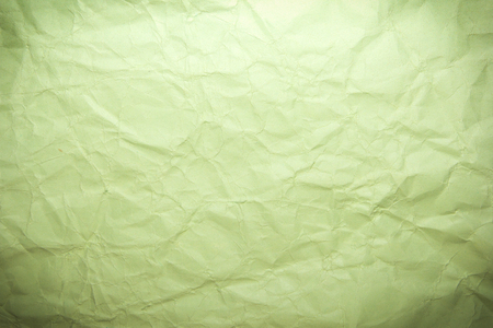Green crumpled recycle paper background and textureの写真素材