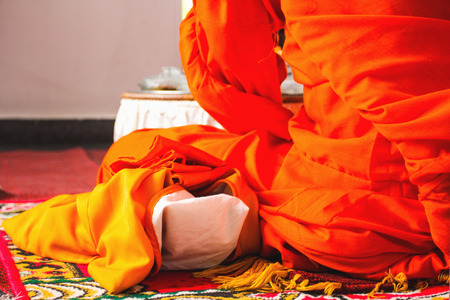 Buddhist monks eating their main meal of the day at noonの写真素材