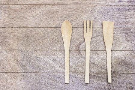 Authentic kitchen wooden utensil of scapula, spoon and fork on wooden backgroundのeditorial素材