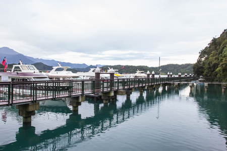 NANTOU, TAIWAN - OCT010, 2016: many boats parking at the pier on October 10, 2016 at Sun Moon Lake, Taiwan. Sun Moon Lake is the largest body of water in Taiwan as well as a tourist attractionのeditorial素材