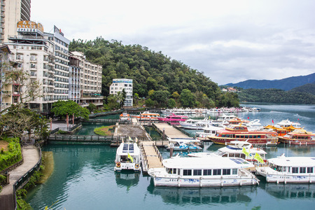 NANTOU, TAIWAN - OCT010, 2016: many boats parking at the pier on October 10, 2016 at Sun Moon Lake, Taiwan. Sun Moon Lake is the largest body of water in Taiwan as well as a tourist attractionのeditorial素材