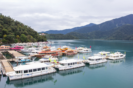 NANTOU, TAIWAN - OCT010, 2016: many boats parking at the pier on October 10, 2016 at Sun Moon Lake, Taiwan. Sun Moon Lake is the largest body of water in Taiwan as well as a tourist attractionのeditorial素材