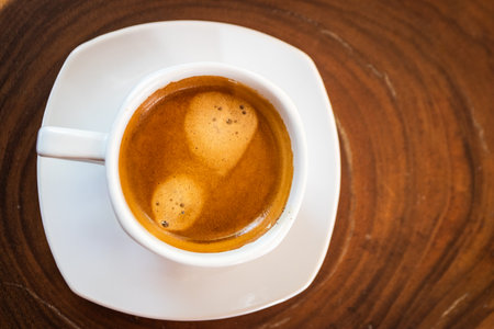 Hot coffee cup on wooden tableの写真素材