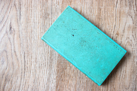 Old and dirty power bank on the wooden table.の写真素材