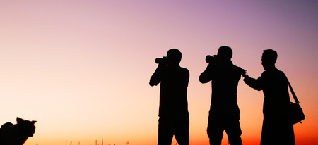 Photographers, silhouette of photographers and sunset.の写真素材