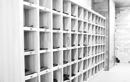 Wood shoes locker and numbers in roomの写真素材