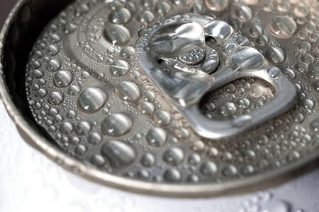 Aluminum can of beverage covered with water drops on background, closeup.の写真素材