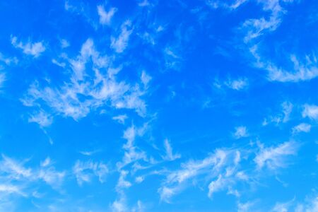 white fluffy clouds in the blue sky.の写真素材