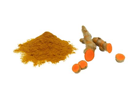 Turmeric powder and fresh turmeric roots isolated on a white background are ingredients in turmeric foods and ingredients in skin care products. Turmeric helps the skin to be strong.の写真素材
