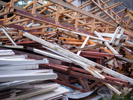 Renovating the building. And there is a pile of scrap in front of the buildingの写真素材